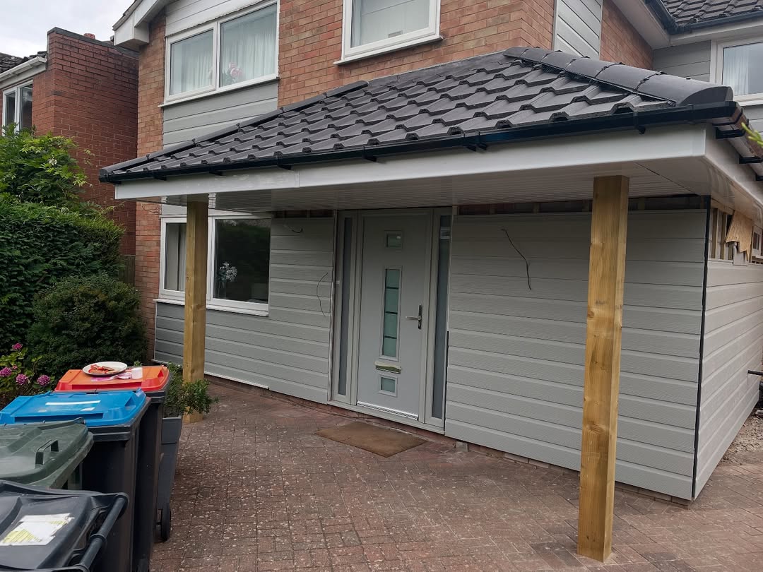 Completed rear extension with tiled canopy roof and cladding, Wirral