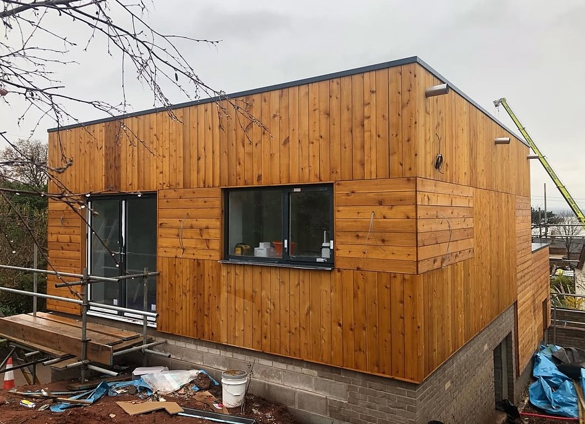 Timber-clad modern extension completed by deevelop Heswall Ltd